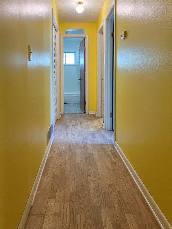 hall featuring light wood-type flooring