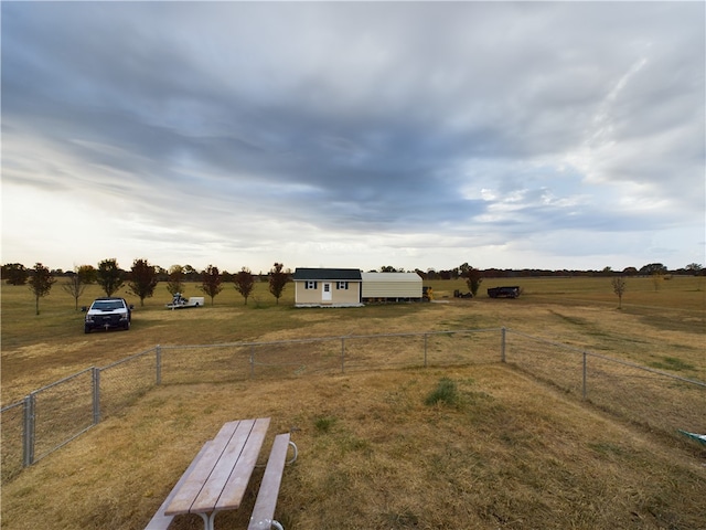 view of yard with a rural view