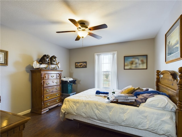 bedroom featuring dark hardwood / wood-style floors and ceiling fan