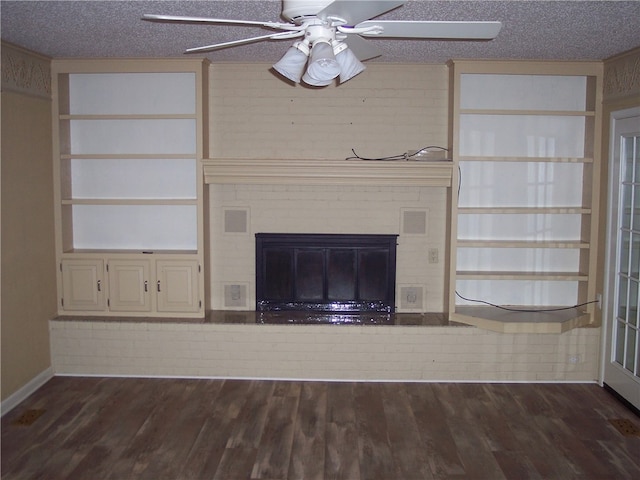 unfurnished living room with dark hardwood / wood-style floors and a textured ceiling