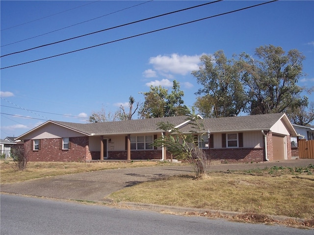 ranch-style house with a front lawn and a garage