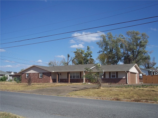 ranch-style house featuring a garage