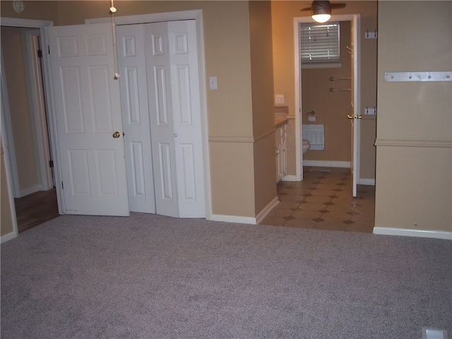 unfurnished bedroom featuring light carpet