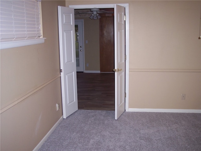 unfurnished bedroom featuring carpet and a closet