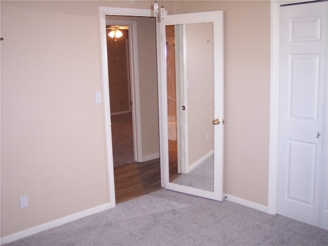 unfurnished bedroom featuring light carpet