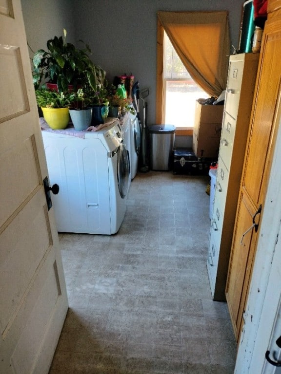 clothes washing area with independent washer and dryer