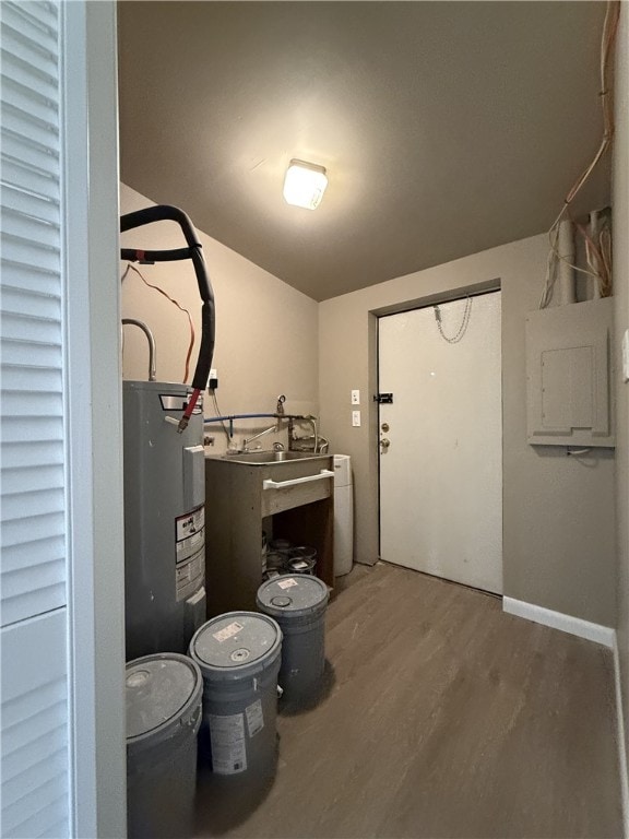 utility room with electric water heater