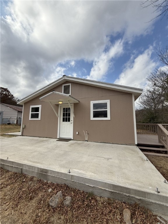 back of property featuring a patio area