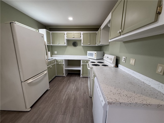 kitchen with white appliances and dark wood-type flooring