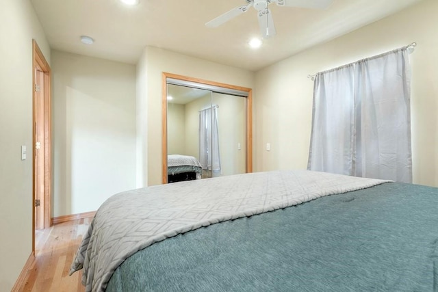 bedroom featuring baseboards, ceiling fan, light wood-style floors, a closet, and recessed lighting