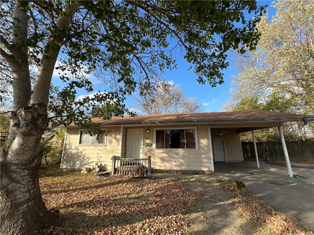 view of front of property featuring a carport