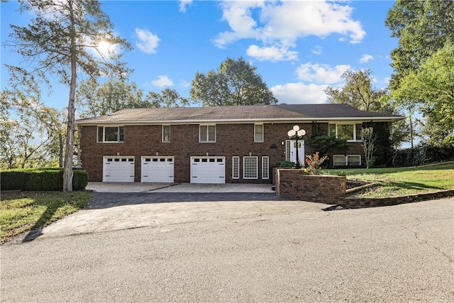 raised ranch featuring a garage