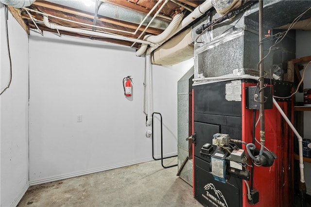 utility room featuring heating unit