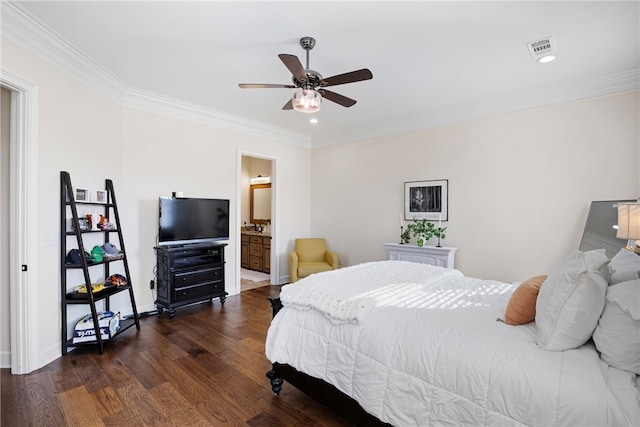 bedroom with connected bathroom, dark wood-type flooring, ornamental molding, and ceiling fan