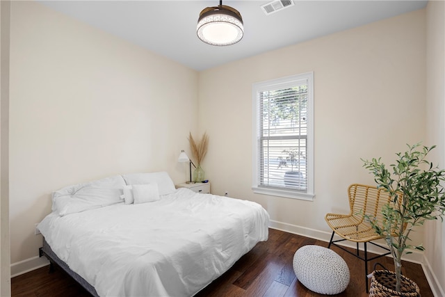 bedroom featuring dark hardwood / wood-style floors