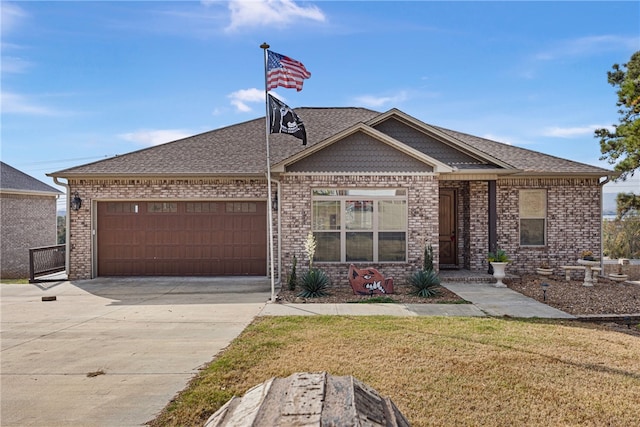 view of front of property featuring a front yard and a garage