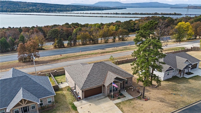 drone / aerial view with a water and mountain view