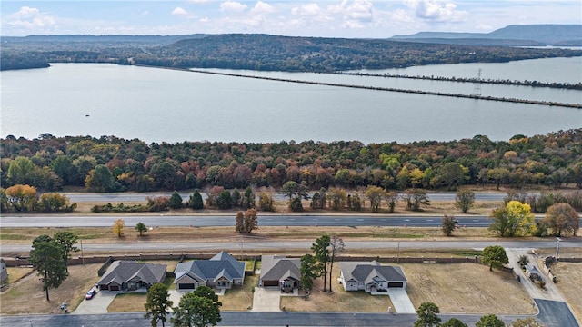 birds eye view of property featuring a water and mountain view