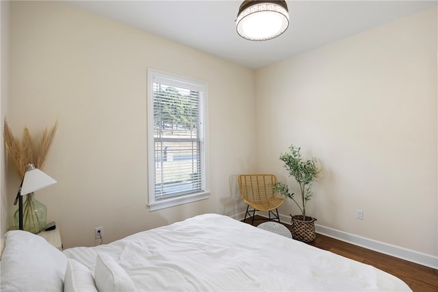 bedroom featuring dark wood-type flooring