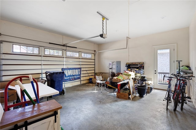 garage featuring a garage door opener and electric panel