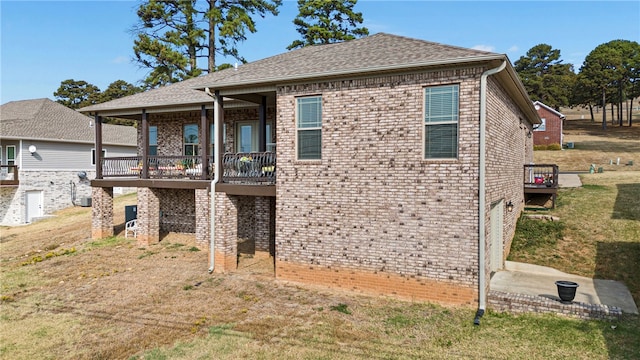 rear view of property featuring a yard