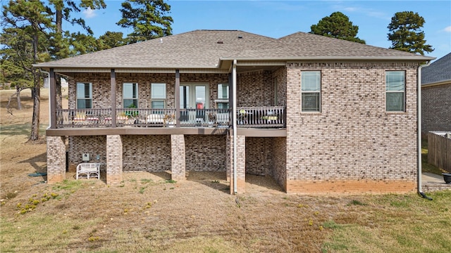 rear view of house with a yard