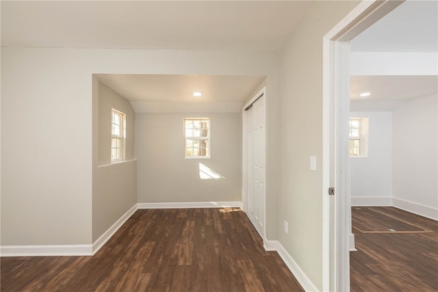 hallway featuring dark hardwood / wood-style floors