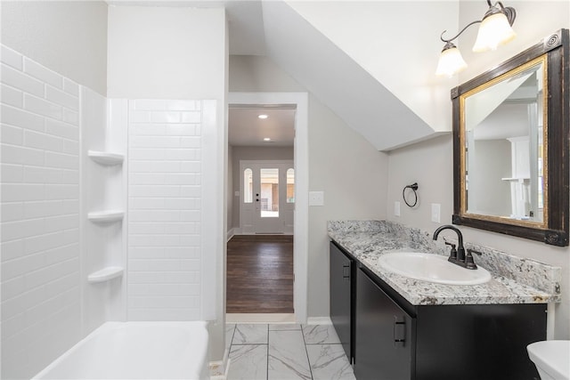 full bathroom with vanity, hardwood / wood-style floors, toilet, and shower / bath combination