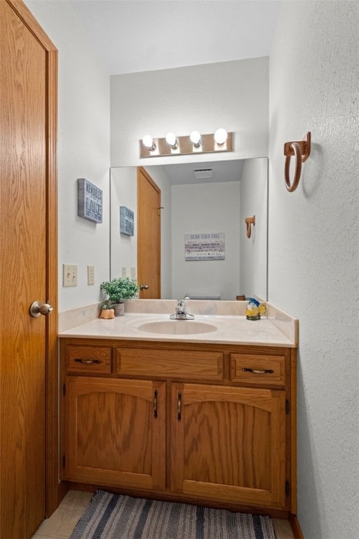 bathroom featuring tile patterned floors and vanity