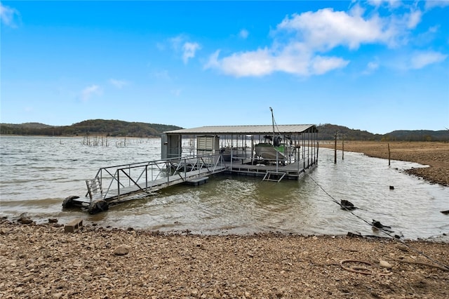 dock area featuring a water view and boat lift