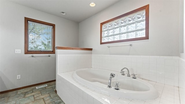 bathroom with tiled tub