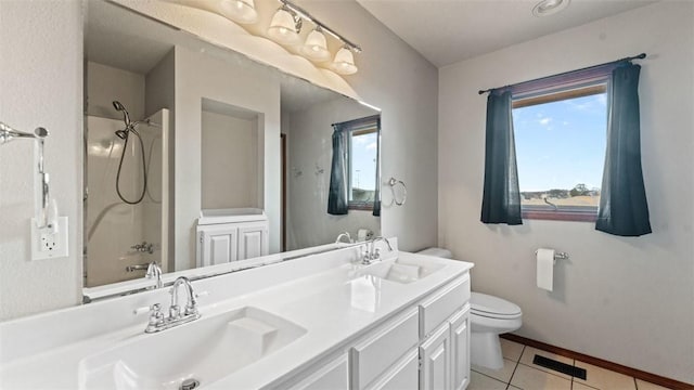 full bathroom featuring tile patterned floors, toilet, tub / shower combination, and vanity