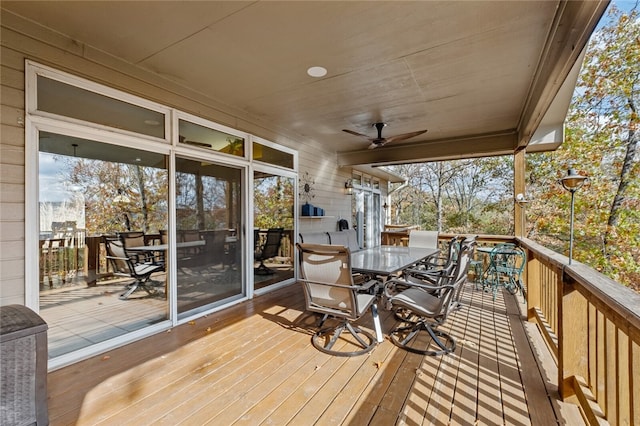 deck featuring a ceiling fan and outdoor dining area