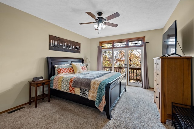 carpeted bedroom featuring a textured ceiling, a ceiling fan, visible vents, baseboards, and access to outside