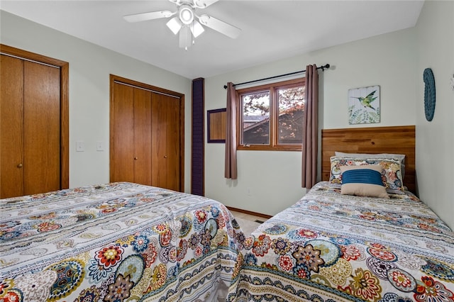 bedroom with two closets and a ceiling fan