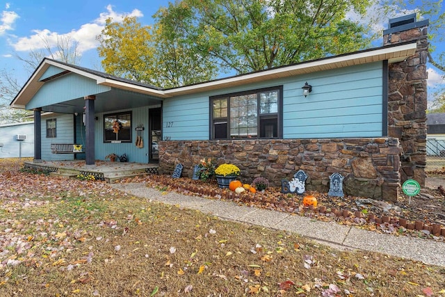 ranch-style home with covered porch