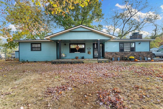 ranch-style home featuring covered porch