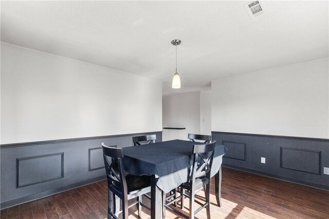 2841 E Hyland Park Rd, Fayetteville, AR 72701 - dining area with wood finished floors, wainscoting, and crown molding