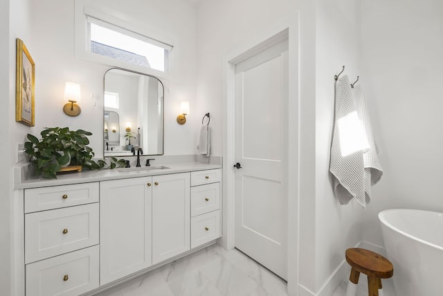 bathroom featuring vanity and a bathtub