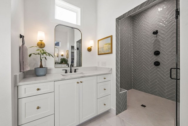 bathroom with vanity and a shower with door