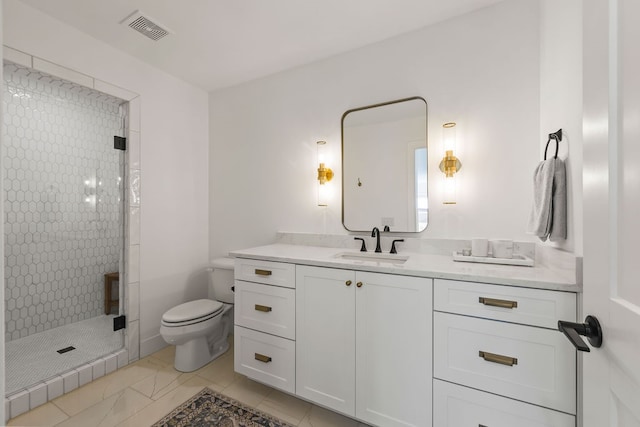 bathroom with vanity, toilet, and walk in shower