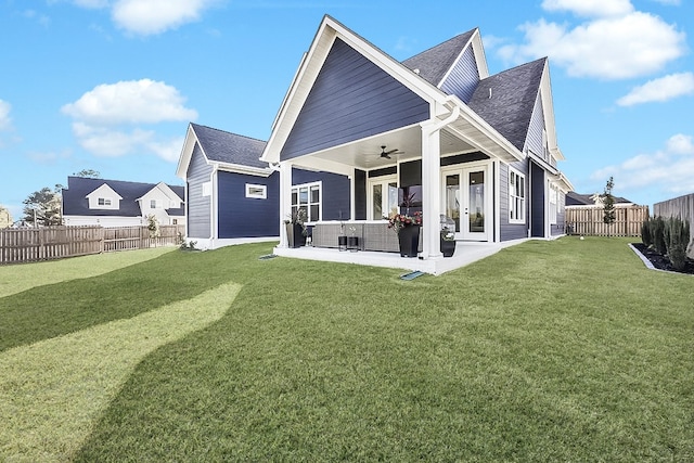 rear view of house with ceiling fan, a patio, central AC unit, and a lawn