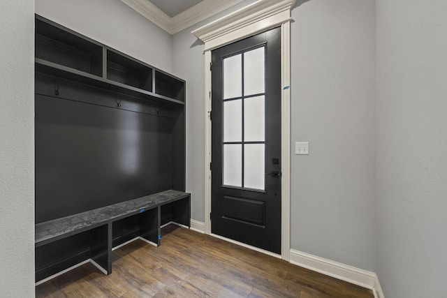 mudroom with dark wood-type flooring and ornamental molding