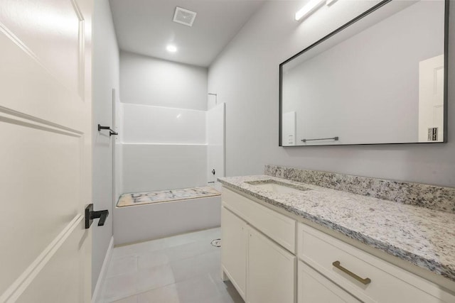 bathroom with vanity, shower / bath combination, and tile patterned flooring