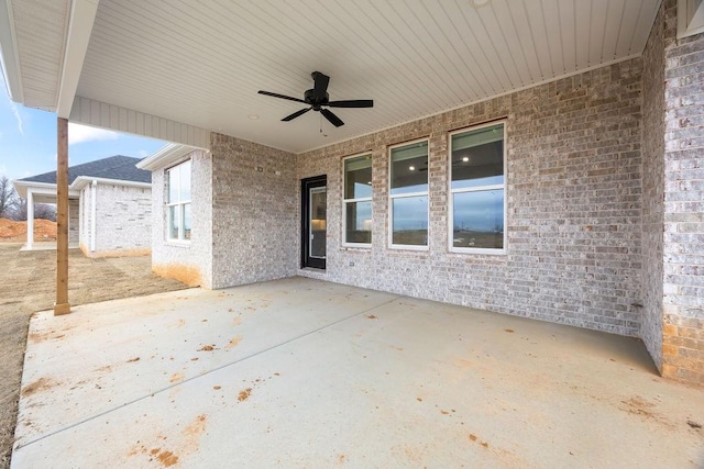 view of patio featuring ceiling fan