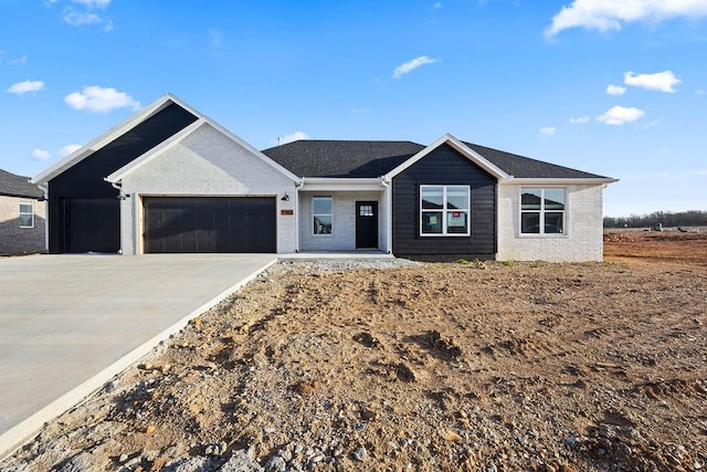 ranch-style home with an attached garage, brick siding, and driveway