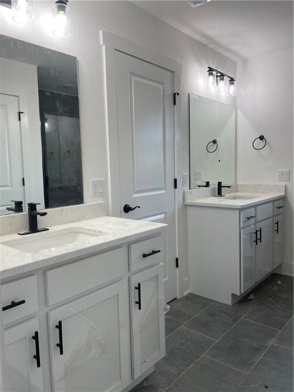 bathroom with vanity and walk in shower