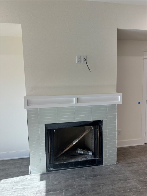 interior details with a tiled fireplace