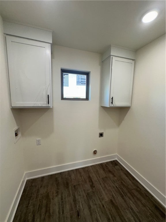 laundry area with cabinets, hookup for a washing machine, hookup for an electric dryer, and dark wood-type flooring