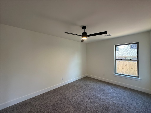 carpeted empty room featuring ceiling fan